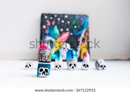 Painted skulls. Little statuette with some psychedelic pictures. Skulls for Day of the Dead and Halloween.