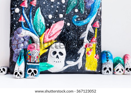 Painted skulls. Little statuette with some psychedelic pictures. Skulls for Day of the Dead and Halloween.