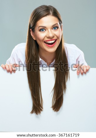 Smiling business woman  with long hair on white  sign board. Young female model smile with teeth.