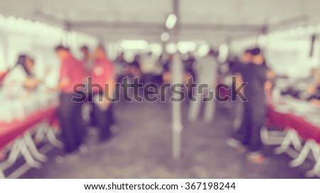 image of blur people at registration point wirth bokeh for background usage .