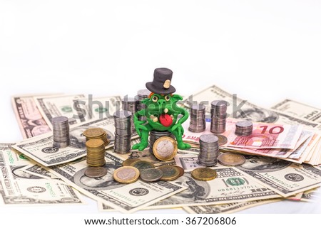 Greedy Leprechaun on the pile of money with tall hat - finance concept isolated on white