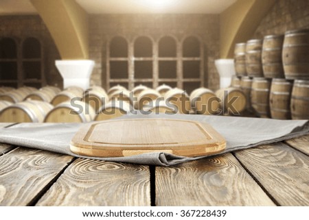 blurred background with old barrels and restaurant table 