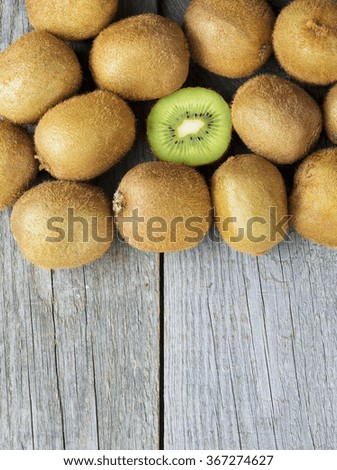 Juicy kiwi fruit on wooden background, room for text. selective focus