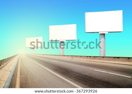 Blank billboard for your advertisement on road curve