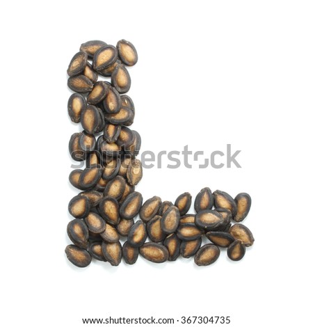 letter L made of watermelon seeds isolated on white background