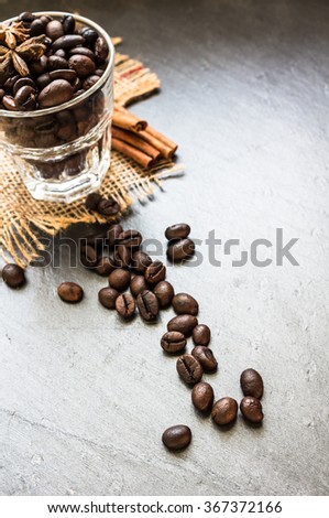Coffee beans on rustic background