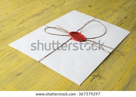 Letter with seal on table