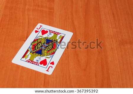 Plastic poker cards on wooden background. Plastic poker cards