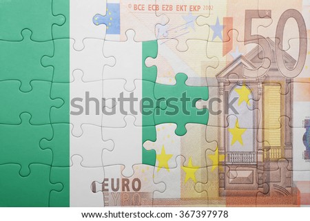 puzzle with the national flag of nigeria and euro banknote . concept
