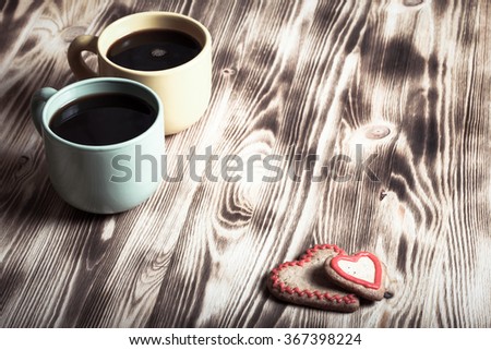 Coffee in cup on wooden table for background. Toned.