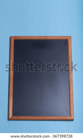 New blue wooden texture with chalk board for background.