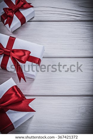 Giftboxes on wood board holidays concept.