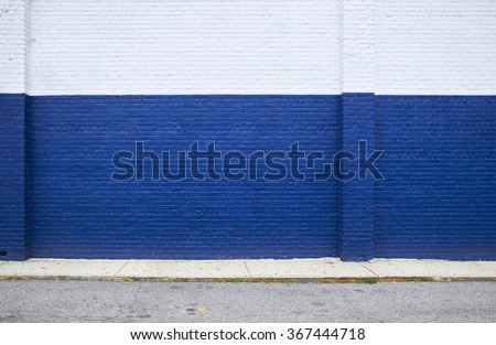 Painted on blue brick wall on the street Royalty-Free Stock Photo #367444718