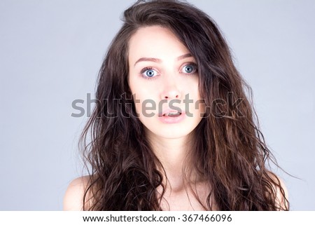 Young woman with very large eyes in surprise