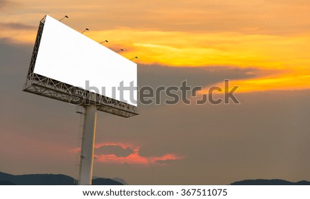 Blank billboard ready for new advertisement with sunset background.