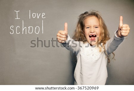 Child about school board. Girl near blackboard
