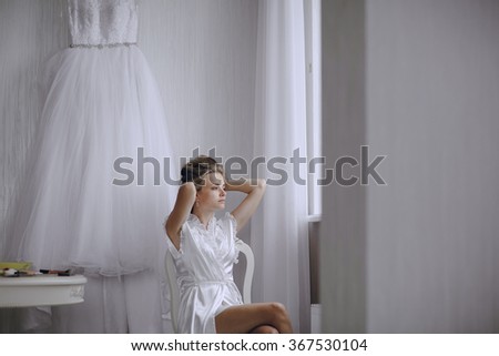 beautiful blonde bride preparing for her wedding