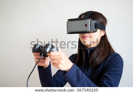 Young Woman play with the vr device