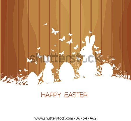 Easter greeting card with rabbit  on the wooden background