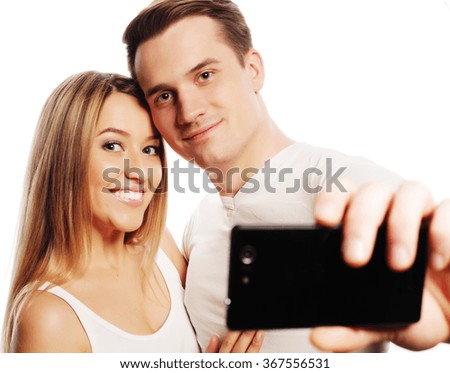 smiling couple with smartphone