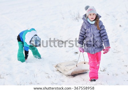 Little girl on sleigh