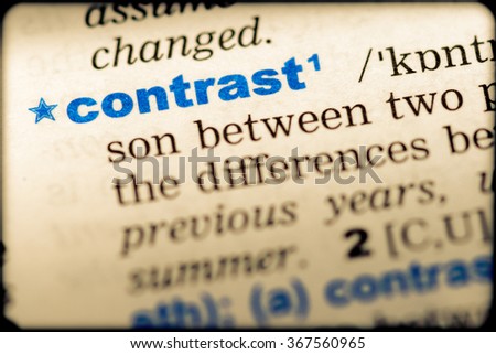 Close-up of word in English dictionary. Contrast, definition and transcription