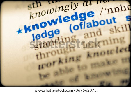 Close-up of word in English dictionary. Knowledge, definition and transcription