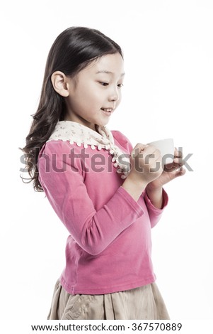 A girls(woman, female) wearing pink blouse and skirt hold a blank(empty) small coffee cup with smile(happy) isolated white at the studio.