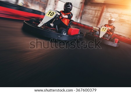 Go kart speed rive indor race opposition race Royalty-Free Stock Photo #367600379