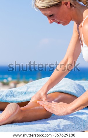 chiropractic massage therapy woman at sea resort