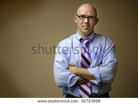 Businessman in dress shirt and tie with neutral background