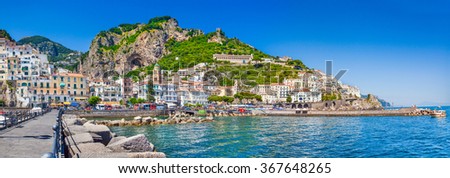 Panoramic picture-postcard view of the beautiful town of Amalfi at famous Amalfi Coast with Gulf of Salerno on a sunny day with blue sky in summer, Campania, Italy