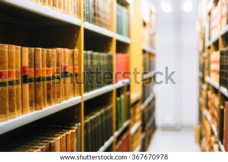 Blurred Background of Old Books On Shelfs In Library
