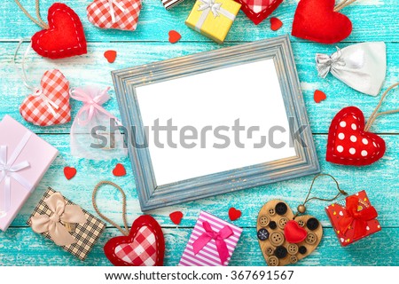 Valentine's day background with heart shapes on wooden table. Beautiful holiday invitation. Mock up for text.