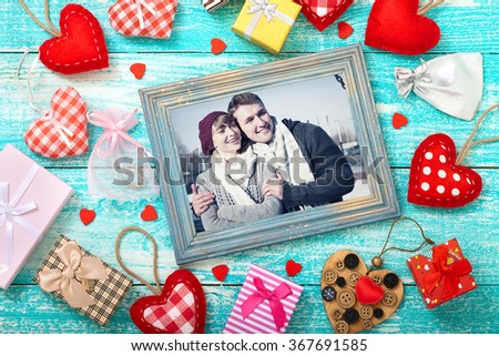 Mock up template frame for Valentine's day with heart shapes. Happy young couple in picture frame. Valentine's Day beautiful background