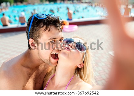 Beautiful couple in the swimming pool