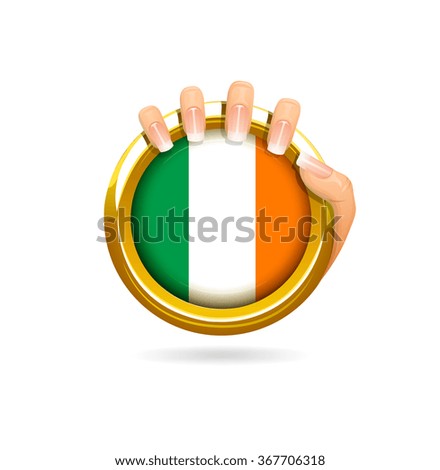 Irish flag golden badge held by woman's hand