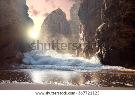 Fantastic big rocks and ocean waves at sundown time. Dramatic scene. Beauty world landscape. Royalty-Free Stock Photo #367721123