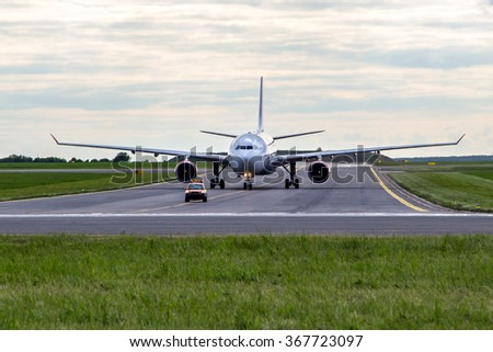 Aircraft taxiing for follow me car at the airport