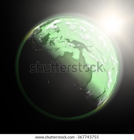 Space view of the sun rising over Australia on green planet Earth. Elements of this image furnished by NASA.