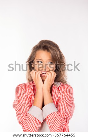 Closeup portrait nervous looking woman biting her fingernails Royalty-Free Stock Photo #367764455