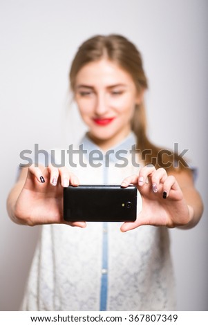 blonde girl photographed on a camera phone, isolated