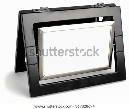 Black photo frame rotated in a plane isolated on white background