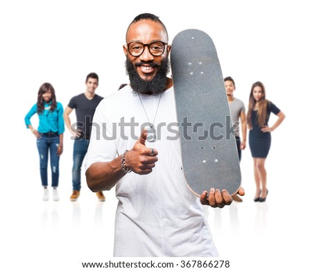 black man holding a skateboard