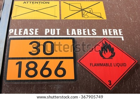 orange-colored plate with hazard-identification number 30 and UN-Number 1866 (resin solution, flammable
