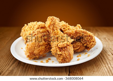 crispy kentucky fried chicken in a wooden table Royalty-Free Stock Photo #368008064