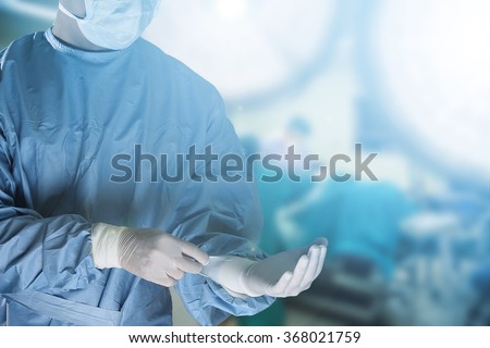 Medical team preparing equipment for surgery  in operation room Royalty-Free Stock Photo #368021759