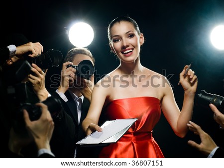 Photographers are taking a picture of a film star