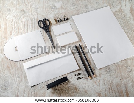 Photo of blank stationery set. Mockup for branding identity on light wooden background. For design presentations and portfolios.