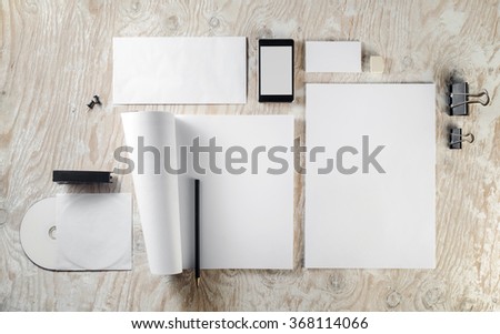Photo of blank stationery template on light wooden background. Mock-up for branding identity. 